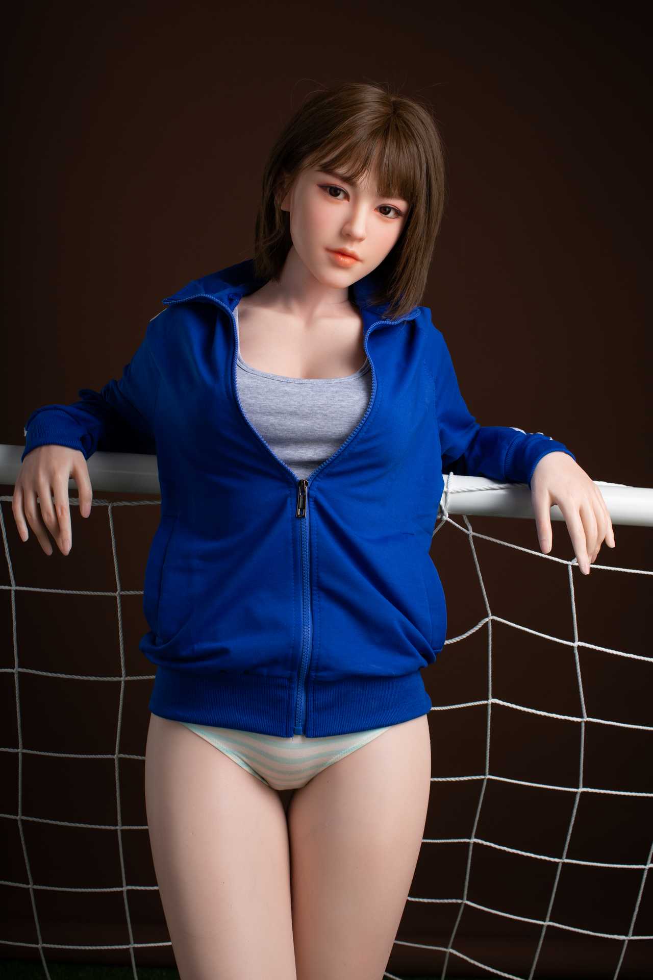 Oanez: Brunette Teen Starpery Love Doll with Football Outfit and Sultry Face Any Love Doll Starpery